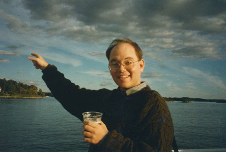 A young Earl J. Wilkinson, before he upgraded his glasses (both on his face and in his hand).