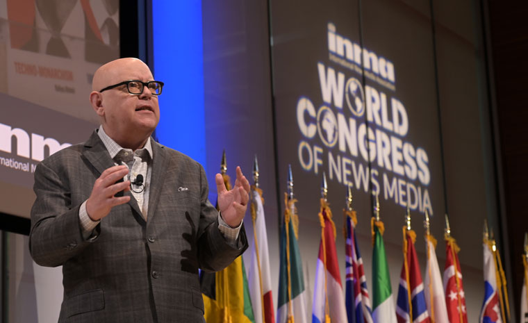 INMA CEO/Executive Director Earl J. Wilkinson speaks on the stage at INMA World Congress of News Media on the "post-search traffic era."