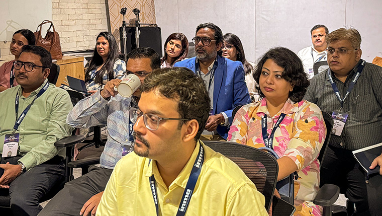 Study tour attendees listening to a presentation at Friday Storytellers.