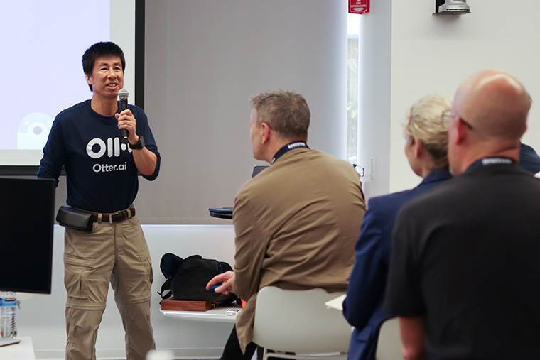 Otter founder and CEO Sam Liang talks with study tour participants.