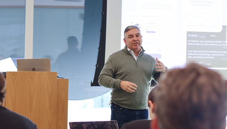 Mark Escobosa, vice president of Salesforce Futures, talks with study tour participants.