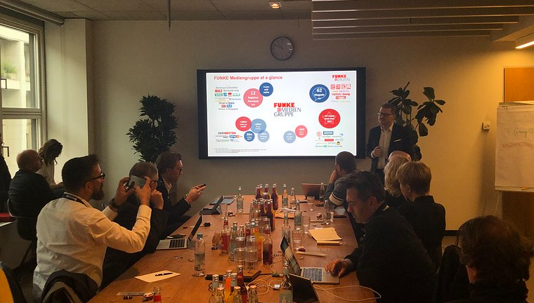 Study tour participants learn how the Funke Mediengruppe newsroom uses data dashboards.