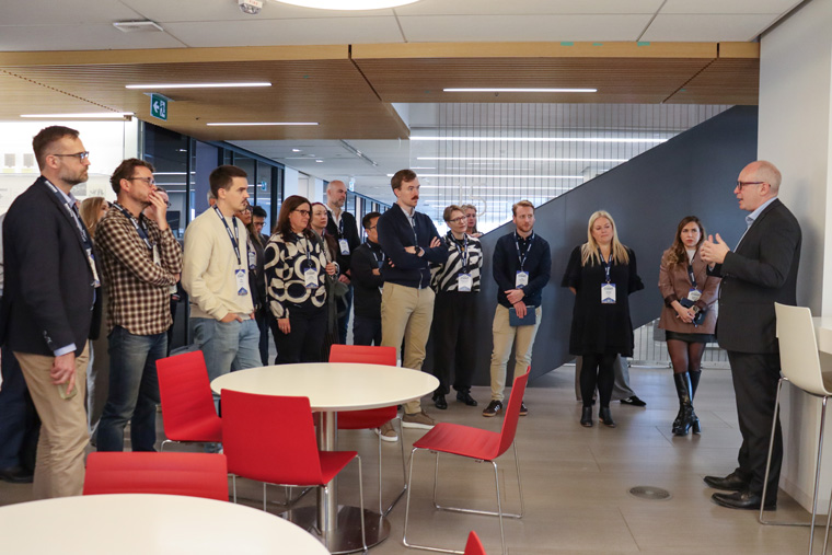 David Walmsley, editor-in-chief at The Globe and Mail, gives a newsroom tour to study tour attendees.