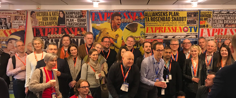 Study tour participants pose for a group photo at Expressen in Stockholm.