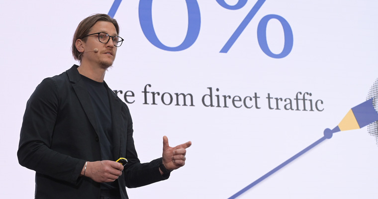 Bonnier News COO Alexander Lydecker speaks on the main stage in Berlin.