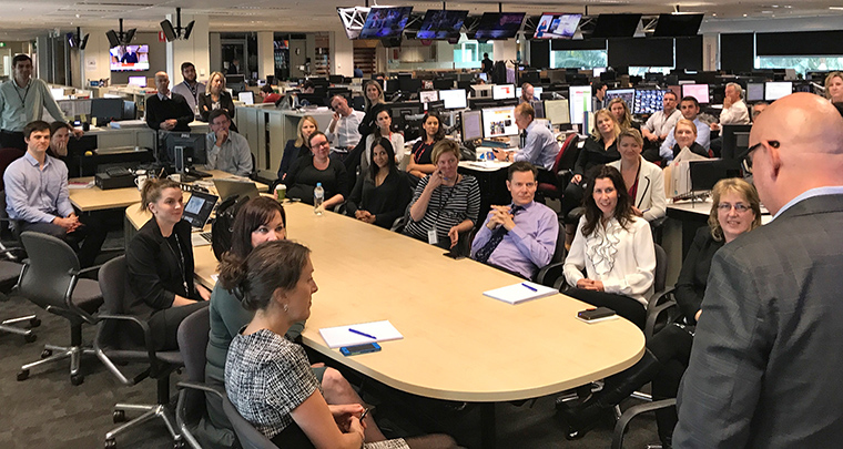 INMA’s Earl Wilkinson addresses the newsroom at Seven West Media in Perth, Australia. Seven West Media houses newspaper, television, radio, and magazine brands in a single newsroom.