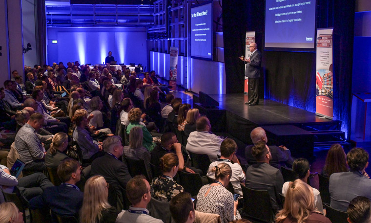 INMA Executive Director/CEO Earl J. Wilkinson gives a presentation at INMA's first in-person conference since the pandemic, Media Innovation Week in Copenhagen in September.
