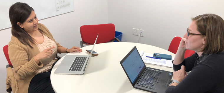 Mentor Nicole Stockdale (right), director of digital strategy, meets with mentee Lorena Flores (left), digital editor of Al Dia, The Dallas Morning News Spanish-language publication.