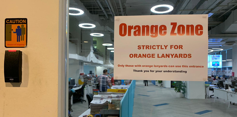 SPH kept editorial staff in the right spaces with coloured lanyards and signage indicating where they should — and should not — be.