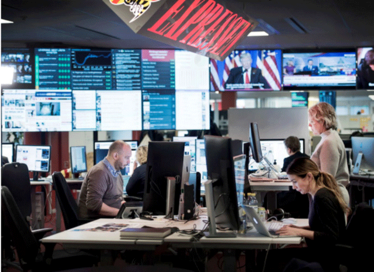 Digital screens in the newsroom allowed departments to see how well their stories were doing and compare their progress to other departments.