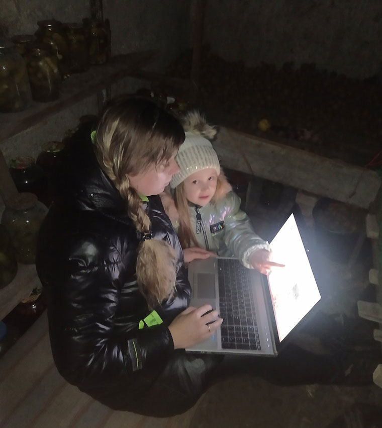Iryna Shevchuk, a reporter of Kazatin.com, works in a bomb shelter together with her 5-year-old daughter Veronika. The nearby military stock was hit by rockets on February 24 and 25.