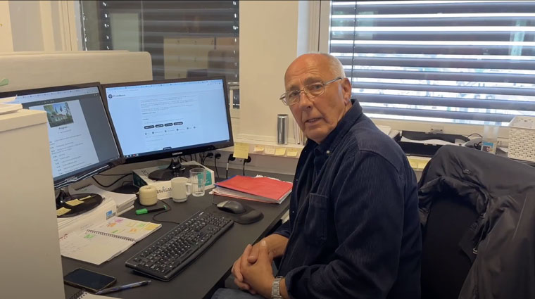 Bjørn-Tore Sandbrekkene, a veteran journalist at Østlands-Posten, uses the AI Sandbox to extract text from PDF documents, saving hours of manual transcription for his coverage of local Constitution Day celebrations.