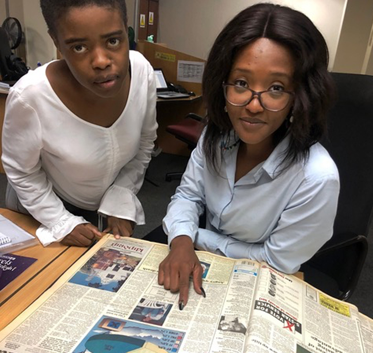 Staff participation was an important aspect of #PretoriaNews120. Here reporters Matlhatsi Dibakwane (left) and Goitsemang Tlhabye look at a back copy from 1994, the year Matlhatsi was born.