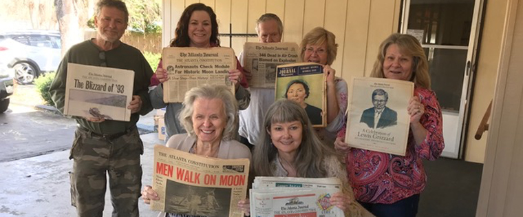 Amy Chown visited with “Mama" Roberta Lee Whitley and her children about the important role of newspapers throughout their lives.