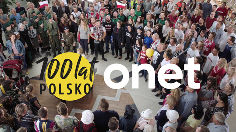 Poles from different social groups sing the national anthem together for an Onet TV commercial.