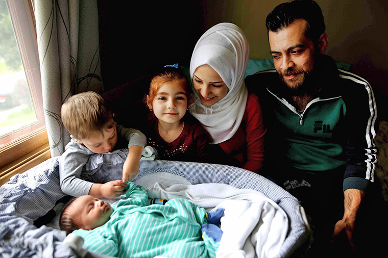 Afraa Bilan, 22, and her husband Muhammad Bilan, 29, came to Calgary in 2016 with two of their children, Nael, 3, and Naya, 5. Their third child was born May 4, 2016, in Calgary, and they named him Justin Trudeau Adam in honour of how Canada had welcomed them with open arms. Photo credit: Leah Hennel/Postmedia