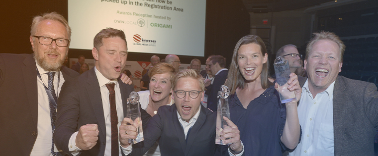 Espen Egil Hansen (second from left) celebrates with his award-winning Aftenposten team.