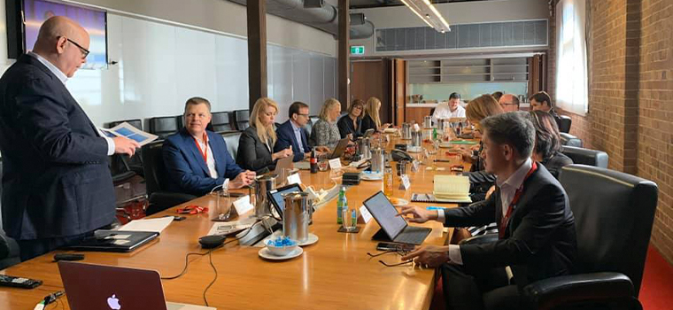 INMA Executive Director Earl J. Wilkinson goes through the day’s agenda with the board of directors at the beginning of the meeting at Nine offices.