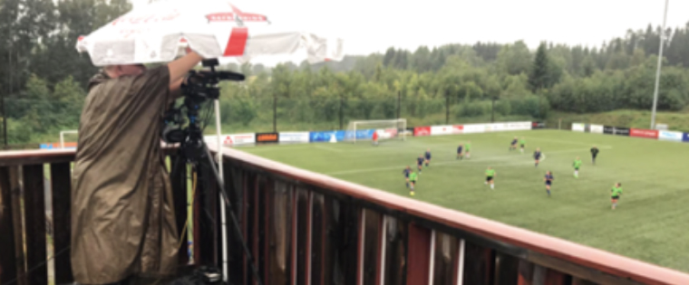 Climbing pitch-side scaffolds in sometimes gale-force winds and huddling under flimsy umbrellas to offer meager defense against driving rain ... all to deliver live streams from local football matches to local newspaper audiences. (Photo: Jan Morten Frengstad, www.ostlendingen.no)