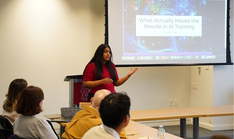 Nikita Roy, host of Newsroom Robots, speaks at a Canadian AI Journalism Network meeting in April.