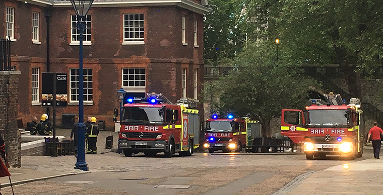 Firetrucks arrive to check on the fire, which started in the kitchen.