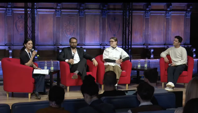 Nicolás Copano, Emilio Doménech, Salla-Rosa Gröhn, and Mitali Mukherjee speaking on a panel at the International Journalism Festival.
