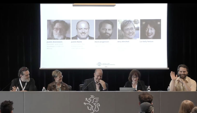 Justin Arenstein, Justin Bank, Dave Jorgenson, Amy Mitchell, and Liz Kelly Nelson speaking on a panel at the International Journalism Festival.