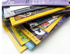 Stack of about ten magazines including National Geographic.
