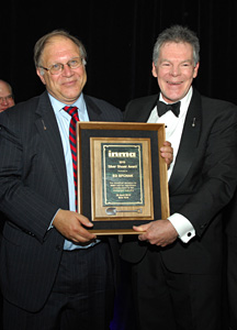Ed Efchak is presented INMA's Silver Shovel Award by Ross McPherson