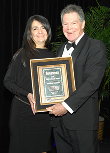 Yasmin Namini is presented INMA's Silver Shovel Award by Ross McPherson