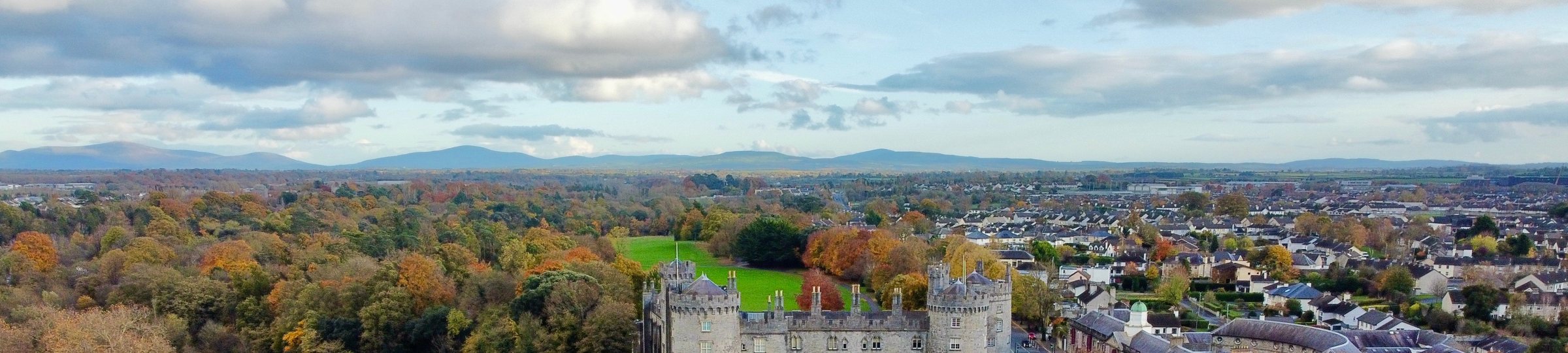 Kilkenny’s rooftops, the castle turrets and the hills beyond